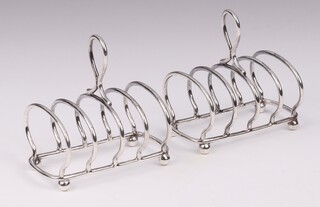 A pair of Victorian miniature silver 5 bar toast racks on bun feet, 6cm, London 1899, makers mark JHM, 77 grams 