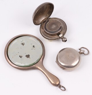 A Victorian silver sovereign case Chester 1897 (dents to lid), ditto London 1896 (f) and a miniature silver hand mirror Birmingham 1915 (mirror is loose to the mount) 