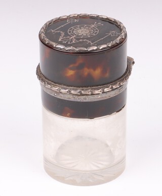 An Edwardian circular cut glass, tortoiseshell pique ware and silver mounted salts bottle with hinged lid, London 1906, 8cm 