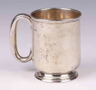 A silver christening tankard, Sheffield 1943 by James Dixon & Sons, the base engraved TF From NJ and SL, 168 grams 