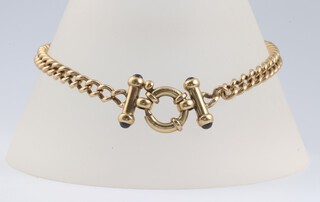 A 9ct yellow gold curb link bracelet, the batons to the ends set cabochon stones, 19cm, 6.9 grams gross 