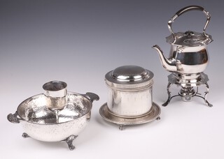 A silver plated tea kettle and stand complete with burner, a silver plated biscuit barrel with hinged lid (base misshapen), a planished silver plated twin handled bowl and a silver plated goblet 
