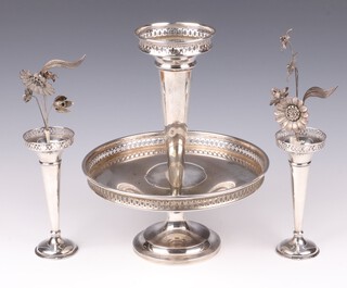 A circular pierced silver plated table centre piece in the form of a vase with bowl beneath on a spreading foot 30cm and a pair of silver plated vases & flowers 17cm 