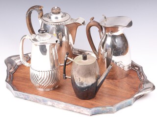 A 19th Century silver plated hot water jug (handle f), 2 silver plated hot water jugs, ditto coffee pot and a mahogany and plated twin handled tea tray 52cm x 33cm 