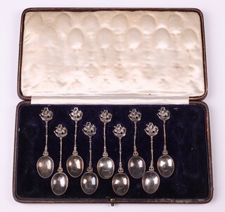 Nine, 925 Continental silver coffee spoons decorated galleons, 102 grams, in a fitted leather case 