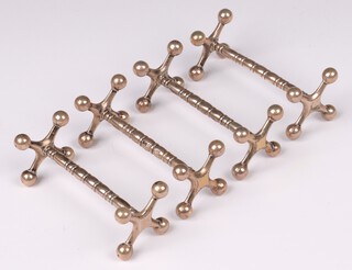 Four Edwardian silver knife rests Chester 1909, 233 grams 