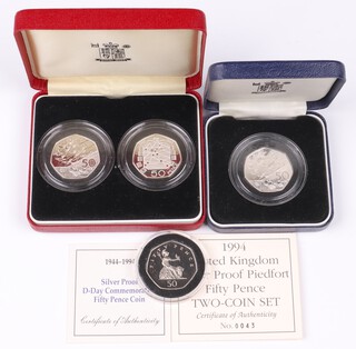 A Royal mint 1994 silver proof piedfort two coin 50p set ( boxed COA ) together with a 1994 silver proof 50p ( boxed COA ) and a 1997 silver proof 50p ( unboxed ) 