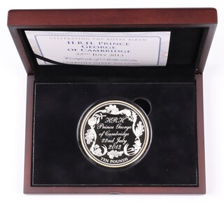 An Elizabeth II 925 Guernsey silver proof 10 pound coin 2013 celebrating the birth of Prince George, 5 oz , mint sealed, contained in fitted case with COA and card slip case. 181 of 450 