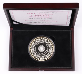 An Elizabeth II 925 Guernsey silver proof 10 pound coin 2015 celebrating the birth of Princess Charlotte, 5 oz, mint sealed, contained in fitted case with COA and card slip case. 13 of 250 