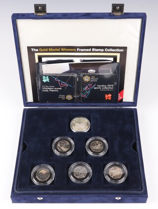 The London 2012 50p cupro-nickel coin collection set, 29 each mint sealed, together with the official Olympic five pound coin contained fitted plush blue display box