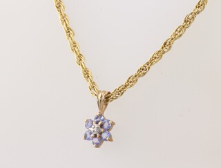A 9ct yellow gold rope twist chain, 46cm, together with a 9ct gold gem set pendant, 3.3 grams gross 