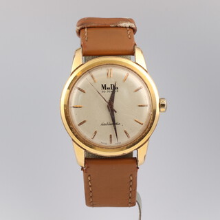 A gentleman's vintage MuDu wristwatch with baton numerals,  contained in a gold plated case with leather strap 