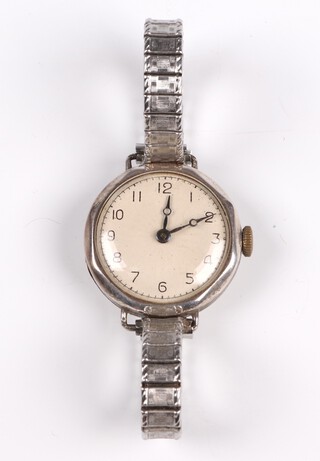 A lady's wristwatch contained in a Continental silver case with expanding bracelet, the back engraved Portsmouth Education Committee 1927 