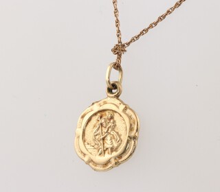 A  9ct yellow gold St Christopher hung on a fine gold chain, 1.8 grams 