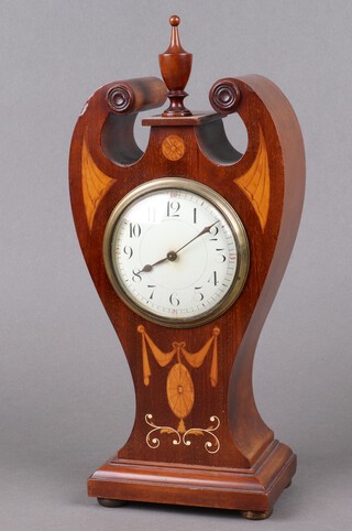 An Edwardian French timepiece with 8cm enamelled dial Arabic numerals, contained in an inlaid mahogany shaped case, complete with key, 32cm h x 12cm w x 8cm d 