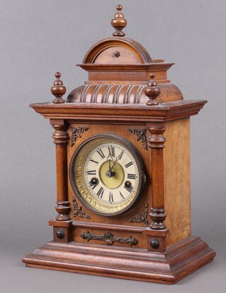 Hamburg American Clock Company, a striking mantel clock with 9cm paper dial, Roman numerals, contained in a walnut case 40cm x 25cm x 15cm, complete with pendulum (no key) 