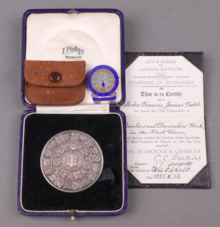 A City and Guilds Final Technological Examination medal to Leslie Francis James Tub Painting and Decoration Works 1st 1929, cased, together with leather cased certificate dated 1933 and an Associates Badge Incorporated Institute of British Decoration in leather pouch 