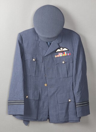 The RAF Uniforms of 54041 Flight Lieutenant FN Ramsey AFC comprising 3 tunics with wings and medal ribbons, 1 by Moss Bros, 2 tunics, 1 by Dewhirst, pair of trousers, mess kit, trousers and waistcoat by R E City Ltd., a great coat, 2 peaked caps, 1 by Alkit, together with rem coat, tropical waistcoat, 4 cummerbunds, 4 shirts and 2 pairs of shorts 