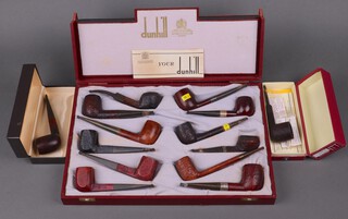 A red Dunhill shop presentation box containing 11 Dunhill pipes - Bruyere EK, Red Bark 41241, a Shell 41241, a 43038 Bruyere, Shell Briar, Shell 498, Shell 5/3 with silver band, 4101 with silver band, Shell Briar, LBS with silver band, 1 other Dunhill pipe and a Lacroix S.A pipe, a Dunhill 59 Black Briar pipe in associated box, a Dunhill R6 Shell Briar in associated box  