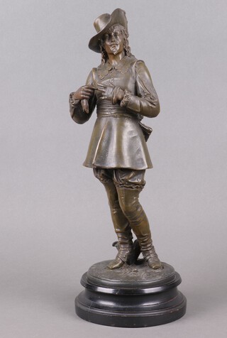 A Victorian spelter figure of a standing Cavalier,  raised on a circular base 47cm h 