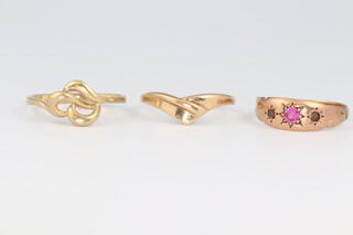 A 9ct yellow gold dress ring set a red stone, size M 1/2 together with 2 9ct gold rings sizes N 1/2 and O, 4.5 grams gross 