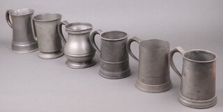 A William IV pewter quart tankard with London touch mark, a Victorian pewter quart tankard with touch mark, 
an Edward VII baluster pewter tankard (sections of pewter missing from base), waisted pewter quart tankard marked J McGlashan & Co. Glasgow (a/f), a Victorian quart tankard with glass base and 1 other pewter tankard (6)