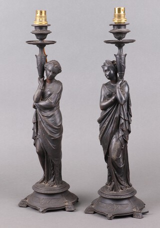 A pair of Victorian spelter candlesticks in the form of standing classical ladies converted to table lamps 43cm 