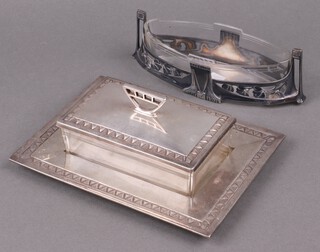 A WMF rectangular butter dish with glass liner, the base marked 10/1 WMF XO 6cm x 21cm x 15cm (some light scratches), together with an oval glass vase contained in a pierced WMF style mount 5cm x 18cm x 7cm 