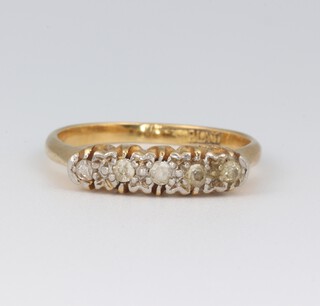 An 18ct gold and platinum illusion set 5 stone diamond dress ring, size I 1/2, 2.7 grams 