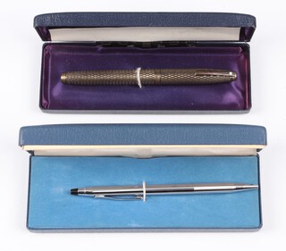A Sheaffer fountain pen with 14ct gold nib, contained in a Sterling silver case together with a Cross ballpoint pen 