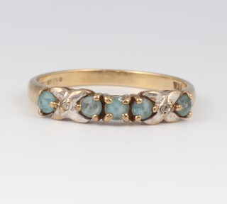 A 9ct yellow gold dress ring set 5 blue stones, size L 