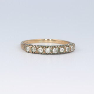 A 9ct yellow gold and paste set half eternity ring size J, 1.2 grams 