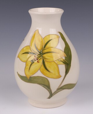 A Walter Moorcroft yellow glazed Bermuda Lily pattern vase, the base marked Moorcroft Made in England with with signature 20cm  