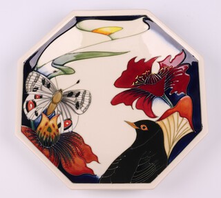 A Moorcroft, 2007 Anniversary Medley Design octagonal plate, decorated a butterfly and blackbird, the reverse is signed by 8 Moorcroft designers including Sian Leeper, Hugh Edwards, Rachel Bishop, Phillip Gibson etc, monogrammed MDS  24.5cm diam. 