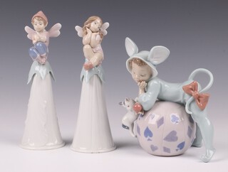 A Lladro figure - Mischievous Mouse no.5881 14cm together with 2 1996 Lladro table bells in the form of seated pixies on flower heads 16cm 