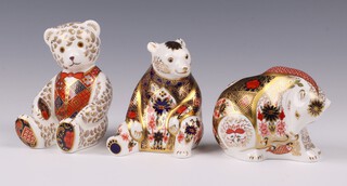 A Royal Crown Derby Imari pattern Exclusive Signature Edition of 500 by Susan Rowell paperweight - Rocky Mountain Bear 7cm, ditto of 250 seated bear for Grovers of Sidmouth, together with a ditto of 950 by John Abbot - Red Tie Teddybear, all boxed 