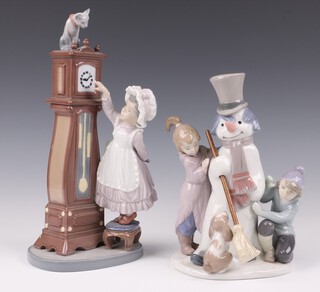 A Lladro figure of The Snowman 5713 and 1 other Bed Time 5347