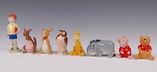 Eight Beswick Walt Disney figures - Christopher Robin 12cm, Kanga, Eeyore, Tigger, Piglet, Winnie the Pooh, Owl and Rabbit   