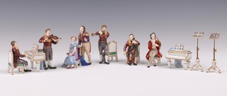 Beyer and Bock, Volkstedt-Rudolstadt,  a 6 piece porcelain figure group comprising violinist, flutist, pianist, cellist, singing couple, seated gentleman and 2 music stands 6cm 