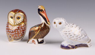 Three Royal Crown Derby Imari pattern paperweights - Snow Owl exclusive the the Collectors Club 2004 MMV with gold stopper 10cm, Brown Pelican 1998 with gold stopper 13cm and Owl LXII with gold stopper 11cm, all boxed 