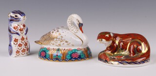 Royal Crown Derby Imari pattern paperweights - 21st Anniversary Otter 2001 MMII with gold stopper 6cm, Swan LIX gold stopper 9cm and Chipmunk LVII with gold stopper 10cm 