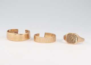 Two 9ct yellow gold wedding bands (cut) approx sizes S & N, and a 9ct gold signet ring, size U, 12.8 grams 