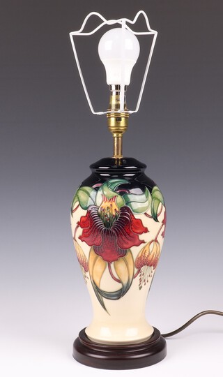 Nicola Slaney for Moorcroft, an Anna Lily pattern table lamp, on a turned wooden base 30cm 