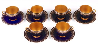 A Royal Worcester 12 piece demitasse coffee service comprising 6 cups and 6 saucers, bases with purple Royal Worcester mark and 25 dots 