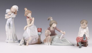 Four Lladro figures - Talk to Me 5987, A Lesson Shared 5475, Chit Chat 5466 and Going to Bed 8019