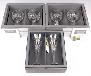 Two pairs of Waterford Crystal Millennium toasting goblets together with a pair of Waterford Crystal Millennium champagne flutes (1 with chip to rim), all boxed 