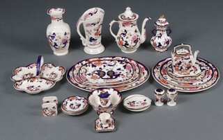 A collection of Masons Mandalay pattern dinner and tea ware including an oval meat plate, rectangular meat plate (second), a limited edition Masons Coronation dresser plate 187/970, a jug (crazed), coffee pot, 3 section dish, club shaped vase (second), twin handled lidded vase, dinner plate, side plate, 3 tier cake stand (no central support), twin handled tray, small teapot, sugar bowl, 4 coffee saucers, 2 small oval vases, salt and pepper pot, 2 small dishes, egg cup, ashtray, a model of a hexagonal pagoda, 4 boxed coasters