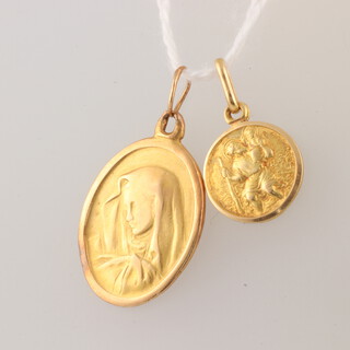 An 18ct yellow gold oval pendant of the Virgin Mary and an 18ct St Christopher pendant 3.3 grams 