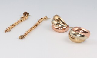 A pair of 9ct 2 colour gold earrings and a pair of 9ct gold rope twist earrings, 2.7 grams 