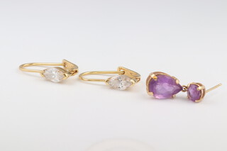 A pair of 18ct yellow gold paste set earrings 2.5 grams together with a single yellow gold, testing as 14ct tea drop shaped earring set amethyst 1 grams  